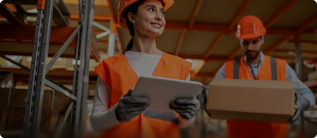 Warehouse staff checking an order on a tablet