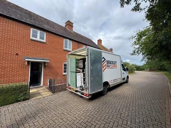 Branded van making a delivery outside a house